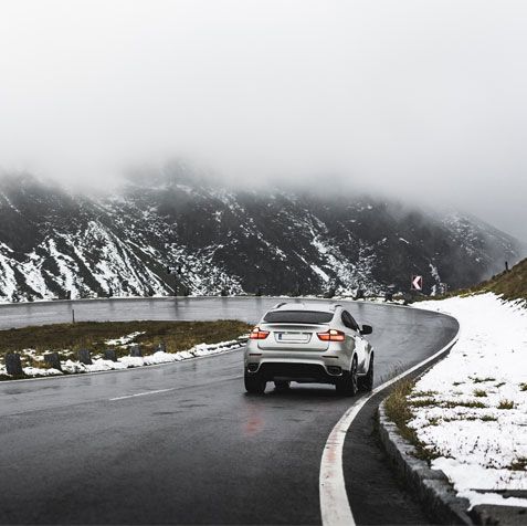 Car Driving Between Snowy Mountains 5