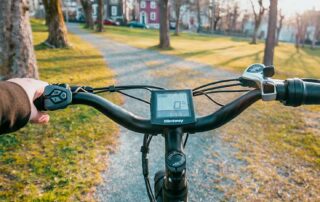 Person Riding Electric Bike on Path